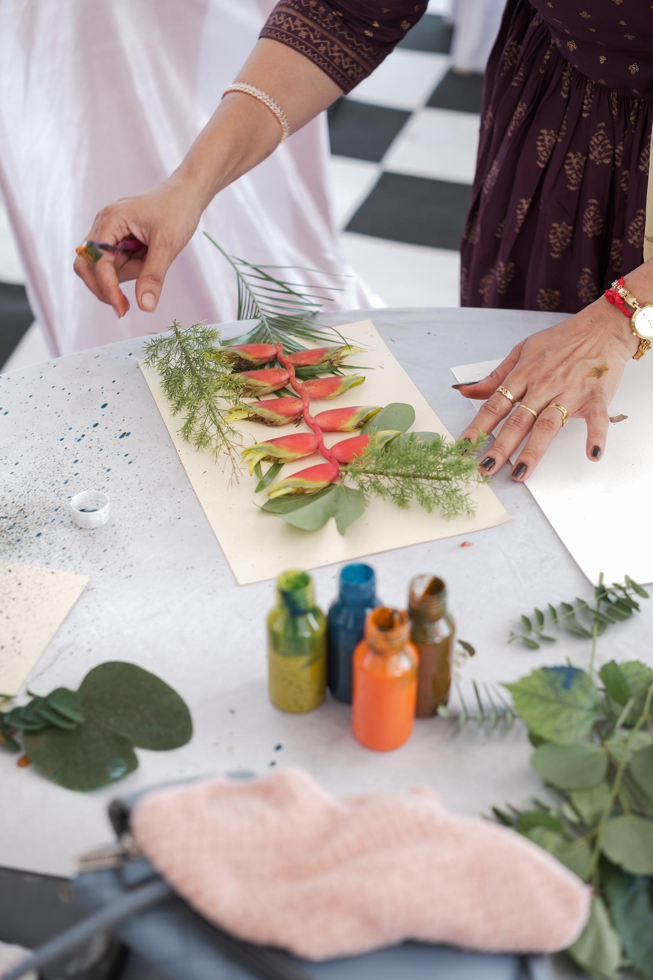 Founder arranging herbs at a studio counter